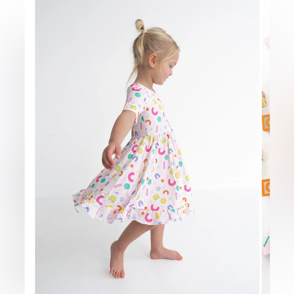 Dream Big Little Co x Cocomelon Alphabet Bamboo Short Sleeve Ruffle Twirl Dress